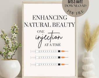 May include: A white printable poster with black text that reads "Enhancing Natural Beauty One injection at a time". Three syringes are shown below the text.