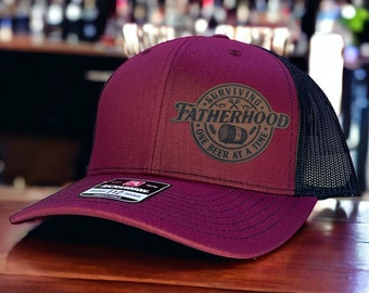 Surviving Fatherhood One Beer At A Time, Richardson 112 Trucker Hat, Funny Hat, Gift for Man, Gift for Husband, Boyfriend gift, Trendy Hat