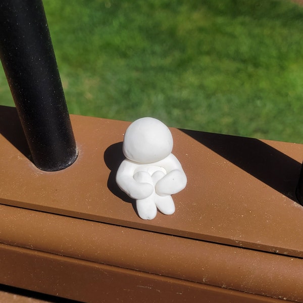 Small White Clay Man Figure Sculpture with Knees to Chest