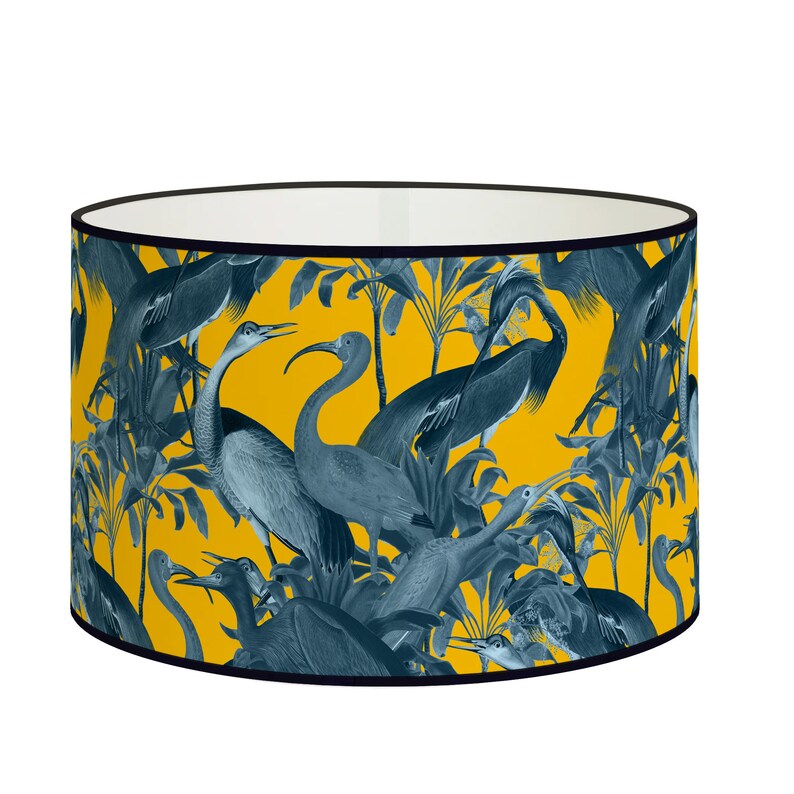 Yellow lampshade with blue heron design