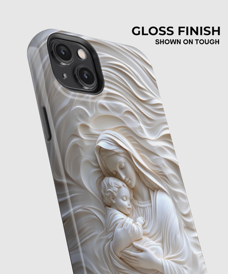 May include: A phone case with a glossy finish featuring a raised, cream-colored relief sculpture of a mother holding a child. The design includes swirling, wave-like patterns surrounding the figures. Text on the image reads GLOSS FINISH SHOWN ON TOUGH.