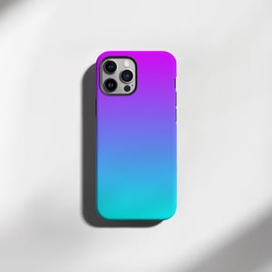 May include: A gradient phone case in shades of purple, blue, and teal. The case has a smooth finish and a camera cutout. The case is designed to fit a smartphone.