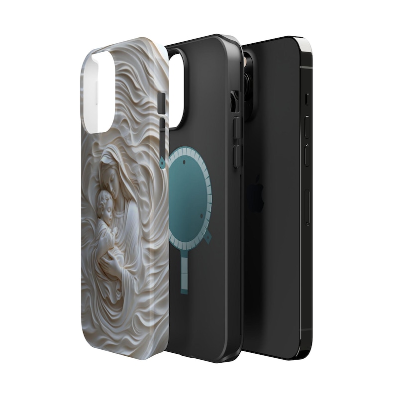 May include: Three phone cases shown in a row. The front case features a cream-colored, three-dimensional relief sculpture of a figure holding a child amidst flowing fabric. The two cases behind it are black with a circular magnetic charging ring.