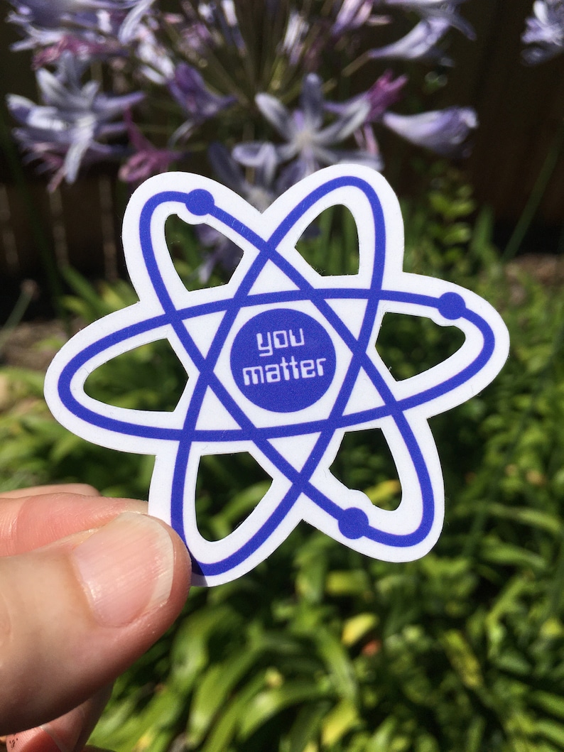 May include: A white sticker with a blue atom symbol and the text "you matter" inside a circle in the center.