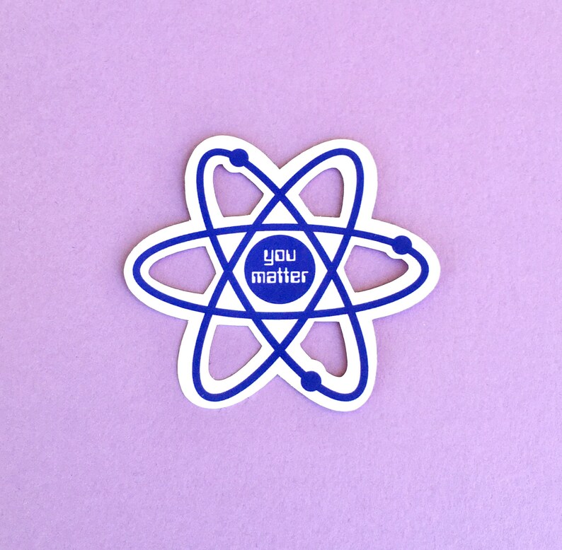 May include: White sticker with a blue atomic symbol and the text "You Matter" in the center.