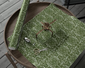 May include: Green and white patterned wrapping paper with a brown ribbon tied around a gift box. The wrapping paper is rolled up next to the gift box.