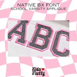 May include: Close-up of a white fabric with the letters "ABC" embroidered in black with pink outlines. The letters are in a bold, blocky font style. The fabric is textured and has a slight sheen.