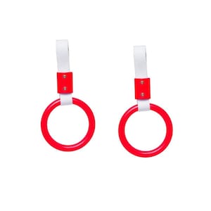 May include: Two circular red plastic handles, each attached to a white fabric strap. The straps are secured to the rings with a rectangular red connector piece featuring two small silver-colored metal rivets on the front of each connector.