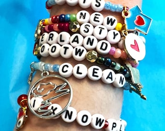 Confezione da 5 braccialetti dell'amicizia Taylor *QUINTO ALBUM* con ciondoli