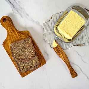 Breakfast set made of olive wood consisting of board and butter knife