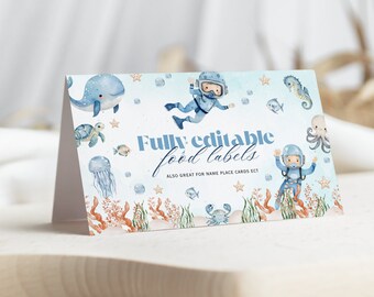 May include: A blue and white printable food label with a watercolor design of a scuba diver, whale, turtle, jellyfish, seahorse, and octopus. The text on the label reads "Fully editable food labels. Also great for name place cards etc."