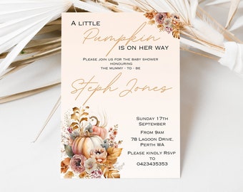 May include: A baby shower invitation with a peach background and gold lettering. The invitation features a watercolour illustration of pumpkins and autumn foliage. The text reads "A Little Pumpkin is on her way". The invitation also includes the date, time, and location of the baby shower.