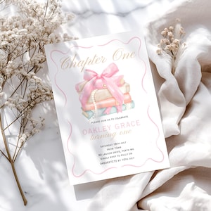 May include: A pink and gold invitation for a first birthday party with the text "Chapter One" and "Oakley Grace turning one". The invitation features a stack of books tied with a pink ribbon and a pearl necklace.