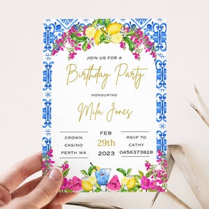 May include: A white invitation with a blue and white tile border. The invitation is for a birthday party honoring Mila Jones. The party is at Crown Casino in Perth, WA on February 29th, 2023. RSVP to Cathy at 0456373828.