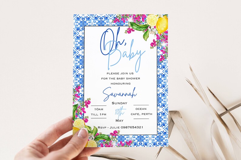 May include: A blue and white patterned baby shower invitation with a floral border and lemons. The text reads "Oh, Baby" and includes the date, time, and location of the event. RSVP information is also included.
