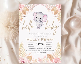 May include: A baby shower invitation with a watercolor illustration of an elephant with pink ears and a floral border. The text reads "hello baby" in gold script and "Please join us to celebrate the mummy to be. Holly Perry Sunday 10th August 123 Lagoon Drive, Perth WA Kindly RSVP to Holly by 2nd August on 0456776565"