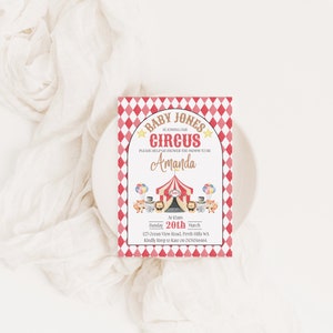 May include: A red and white checkered baby shower invitation with a circus theme. The invitation says "Baby Jones is joining our circus" and "Please help us shower the mommy to be Amanda". The invitation also includes a date, time, and location.