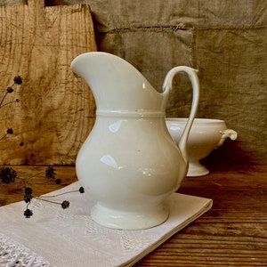 Antique French white round-bellied jug .  Vintage Ironstone