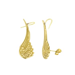 May include: A pair of gold-toned earrings with a wing design. The earrings are made of metal and have a delicate, intricate design.