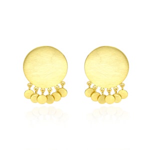 May include: A pair of gold-toned earrings with a large round disc and a fringe of smaller round discs hanging from the bottom.