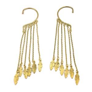 May include: A pair of gold ear cuffs with dangling chains and feather charms. Each cuff has five chains with a small feather charm at the end.