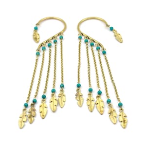 May include: A pair of gold ear cuffs with turquoise beads and gold leaf charms hanging from chains.