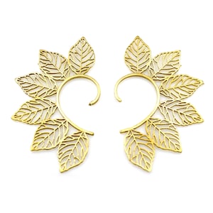 May include: A pair of gold leaf ear cuffs. Each cuff features a delicate, intricate design of multiple leaves.
