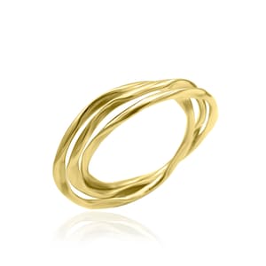 May include: A gold-toned ring with three intertwined bands. The bands are smooth and have a slightly wavy texture.