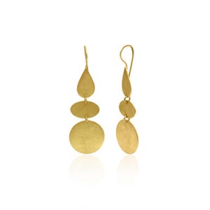 May include: A pair of gold dangle earrings with three layered circles and a teardrop shape at the top.