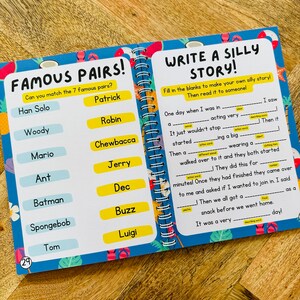 May include: A colorful worksheet with a blue background and a yellow border. The worksheet is divided into two sections. The left section is titled "Famous Pairs!" and has a list of 7 famous characters from movies and cartoons. The right section is titled "Write a Silly Story!" and has a fill-in-the-blank story with a blank space for each word. The worksheet is designed for children to practice their reading and writing skills.