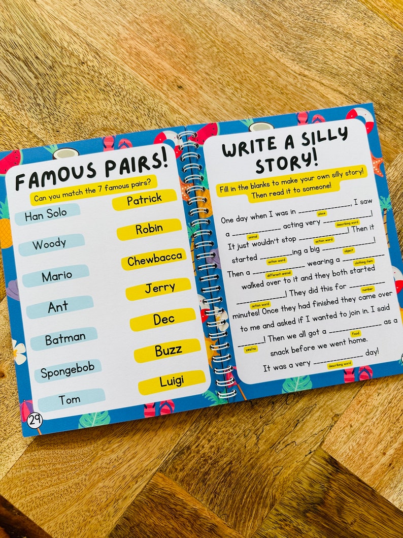 May include: A colorful worksheet with a blue background and a yellow border. The worksheet is divided into two sections. The left section is titled "Famous Pairs!" and has a list of 7 famous characters from movies and cartoons. The right section is titled "Write a Silly Story!" and has a fill-in-the-blank story with a blank space for each word. The worksheet is designed for children to practice their reading and writing skills.