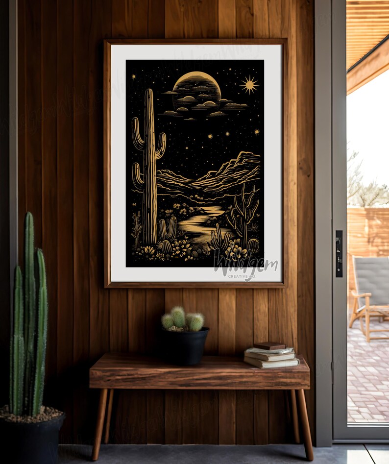 The art piece hanging on a warm wood-paneled wall above a bench with cactus decor and southwestern pottery.