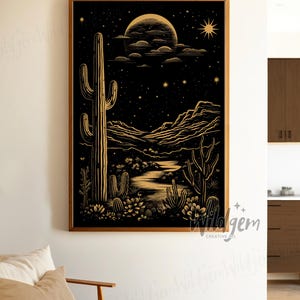 The framed artwork displayed in a soft white corner next to a wooden chair, styled with a casual, minimal aesthetic.