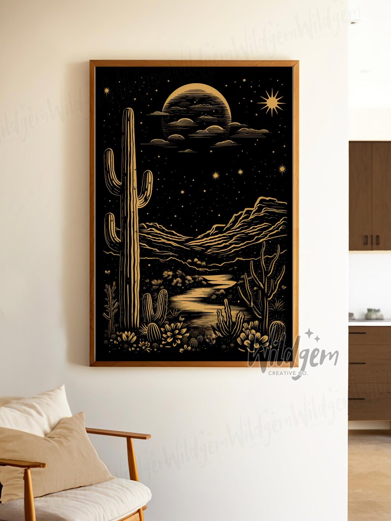 The framed artwork displayed in a soft white corner next to a wooden chair, styled with a casual, minimal aesthetic.