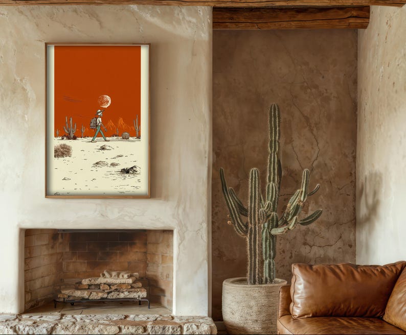 Poster displayed on a dark wood wall with cactus decor and soft ambient light, adding warmth and character to a vintage western interior.