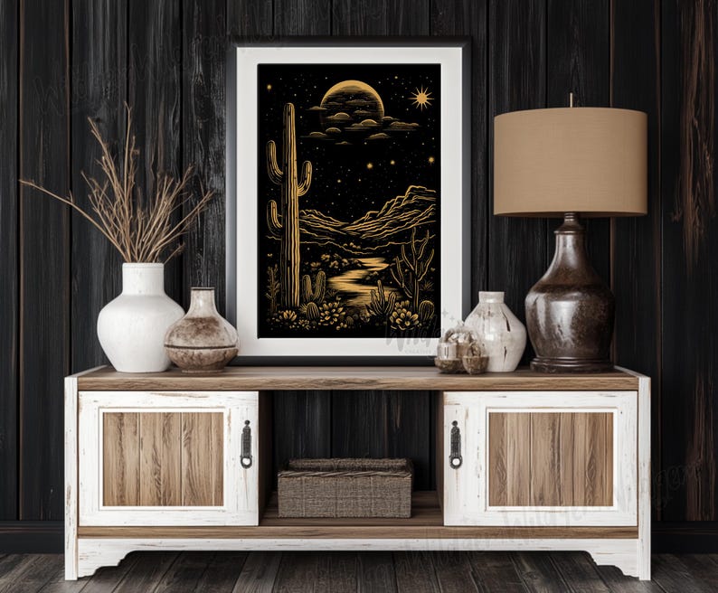 The print displayed on a dark wood-paneled wall above a two-tone rustic console table with a ceramic vase and modern lamp.
