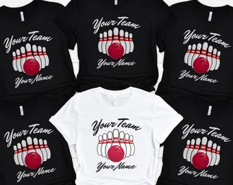 May include: Five black t-shirts with white text and a bowling ball and pins graphic. The text reads "Your Team" and "Your Name". One white t-shirt with the same graphic and text.