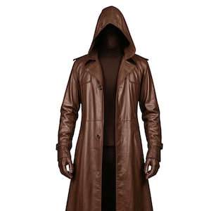 May include: A long brown leather trench coat featuring a hood, a button-front closure, and shoulder epaulets. The coat is worn over a dark brown turtleneck, black trousers, and dark brown gloves, creating a full-length ensemble.