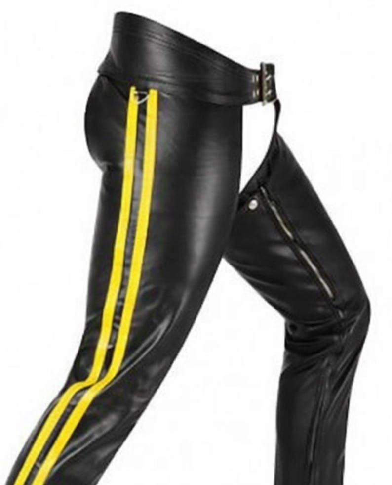 May include: Black leather chaps with two vertical yellow stripes on the side of the leg. The chaps have a belt with a silver buckle and a zipper on the side of the leg.