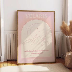May include: A pink and cream poster with the text "VELARIS" in a serif font. The poster features a crescent moon, stars, and mountains with the text "to the stars who listen and the dreams that are answered" and "THE CITY OF STARLIGHT".