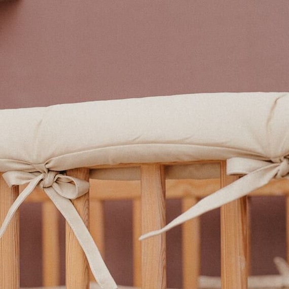 beige crib bumper