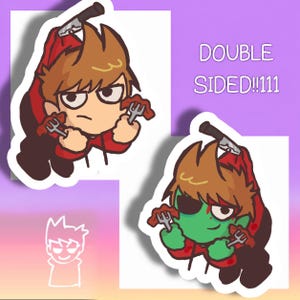 May include: A double-sided sticker featuring a cartoon character with brown hair wearing a red hoodie. The character holds forks with food and has a knife on their head. One side shows a tan-skinned character, while the other shows a green-skinned version.