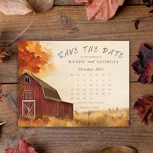 May include: Save the date card featuring a watercolour illustration of a red barn in a field with autumn foliage. The text reads "Save the Date for the wedding of Randy and Georgia, October 2024".