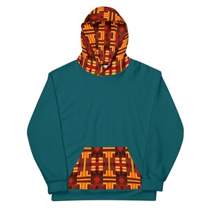 May include: Teal blue hoodie with a geometric pattern in red, orange, and brown on the hood and pocket.