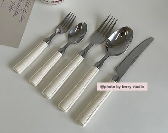 white leather stainlelss steel cutlery set of 5 (2 folk, 2 spoon, 1 knife)