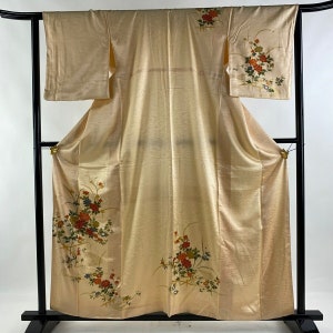 Tsukesage kimono made of embossed gold silk fabric with floral designs. Dated Japan Showa/Heisei period