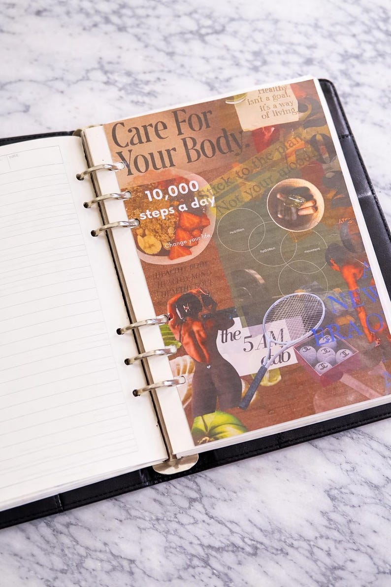 May include: Open black leather-bound planner with lined pages and a collage insert. The insert features text that reads "Care For Your Body" and "10,000 steps a day." The collage includes images of food, tennis balls, and a tennis racket.