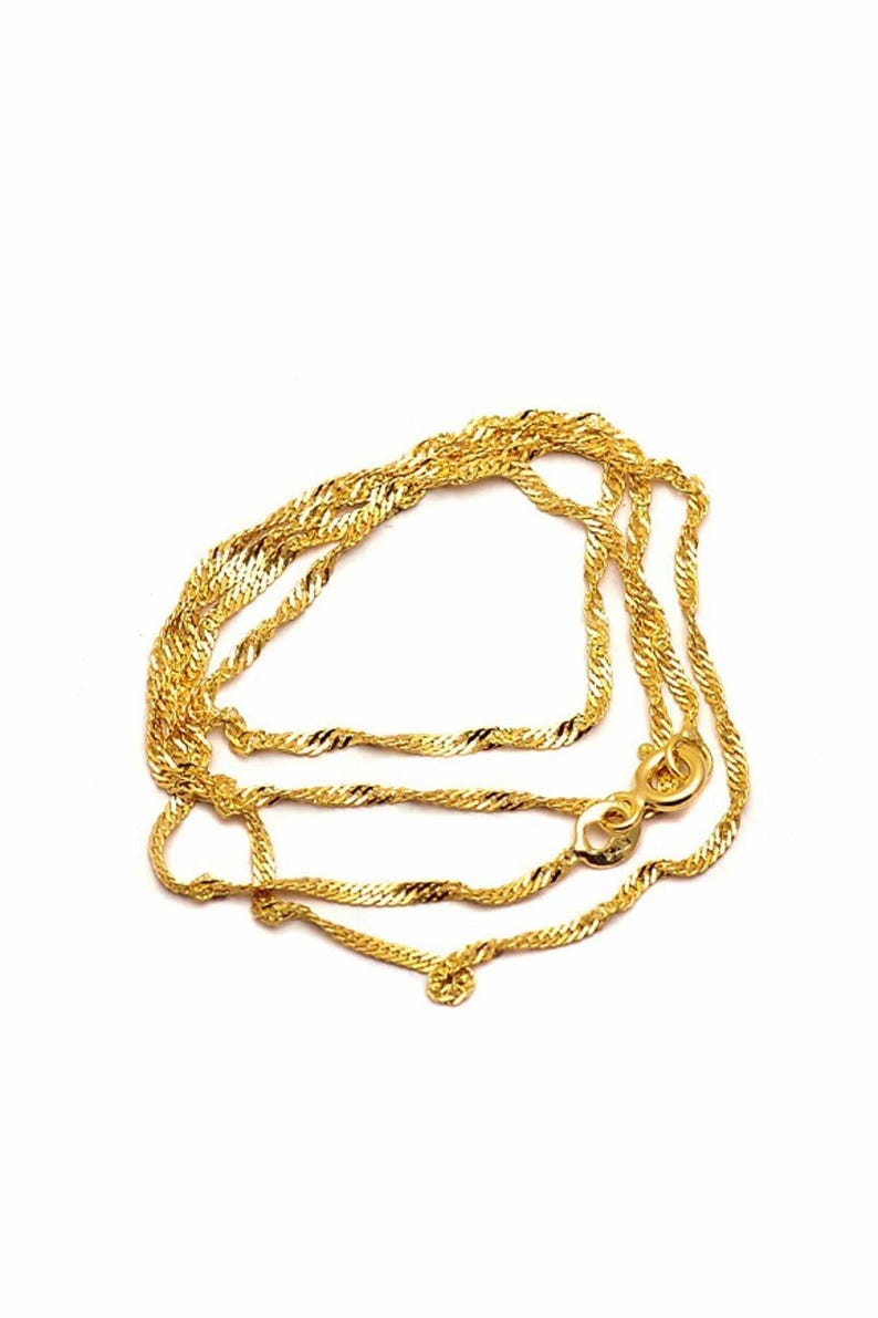 A simple and elegant 45 cm gold-plated 925 sterling silver chain necklace with a smooth golden polish.
