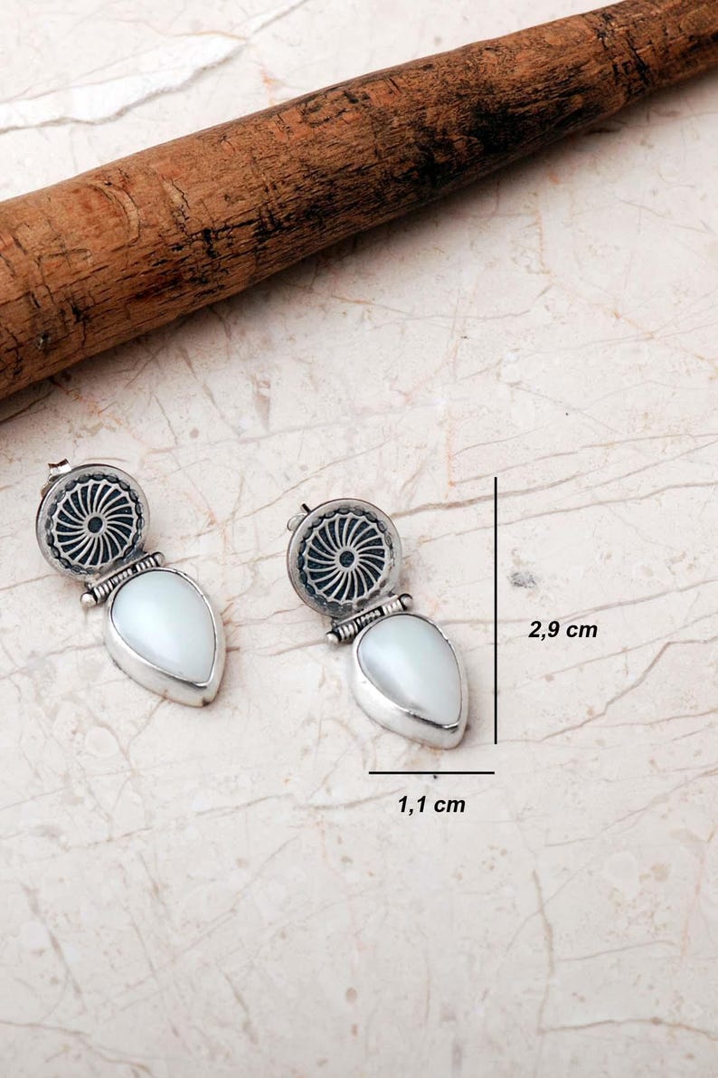 Handmade 925 sterling silver teardrop jewelry set featuring a mother of pearl pendant necklace and matching drop earrings adorned with intricate vintage motifs and an oxidized silver finish.
