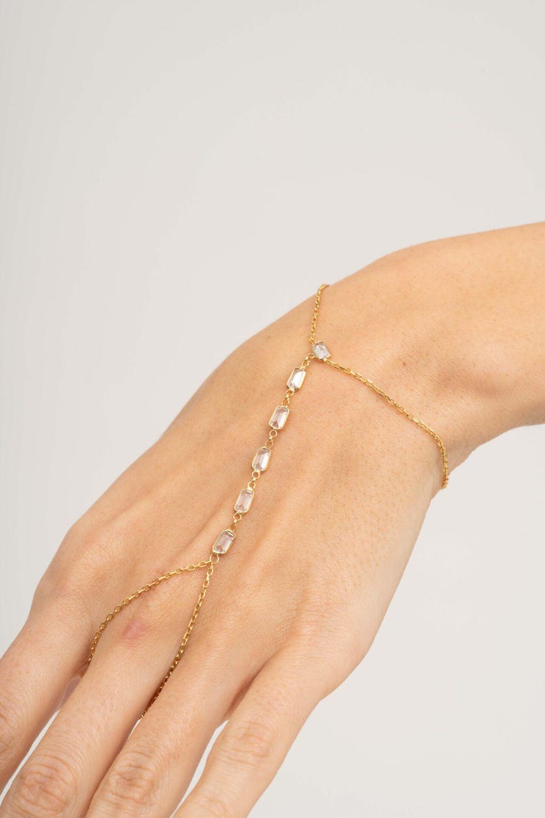 Gold‑plated sterling silver Shahmeran bracelet featuring intricate filigree and sparkling cubic zirconia stones.